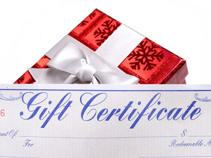 gift certificate in front of present with bow