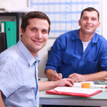 two employees at a table